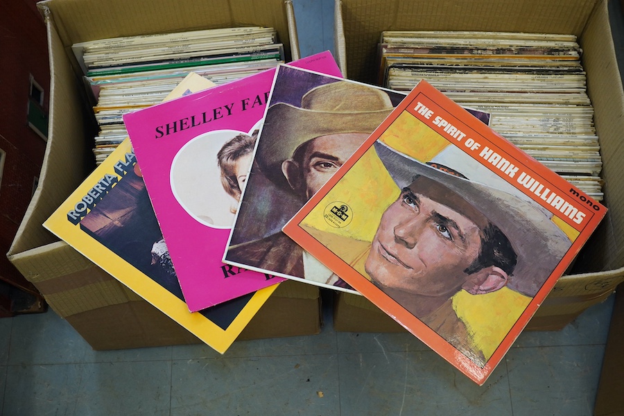 Two boxes of LP record albums, artists include; Billie Holiday, Jackie DeShannon, Timi Yuro, Connie Francis, Eddie Cochran, Gene Vincent, Hank Williams, Pete Seger, Donovan, Lindisfarne, etc. Condition - fair to good.